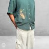 Oversized Green Cotton Shirt with embroidered songbird design