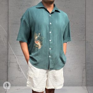 "Oversized Green Cotton Shirt with embroidered songbird and white cotton shorts