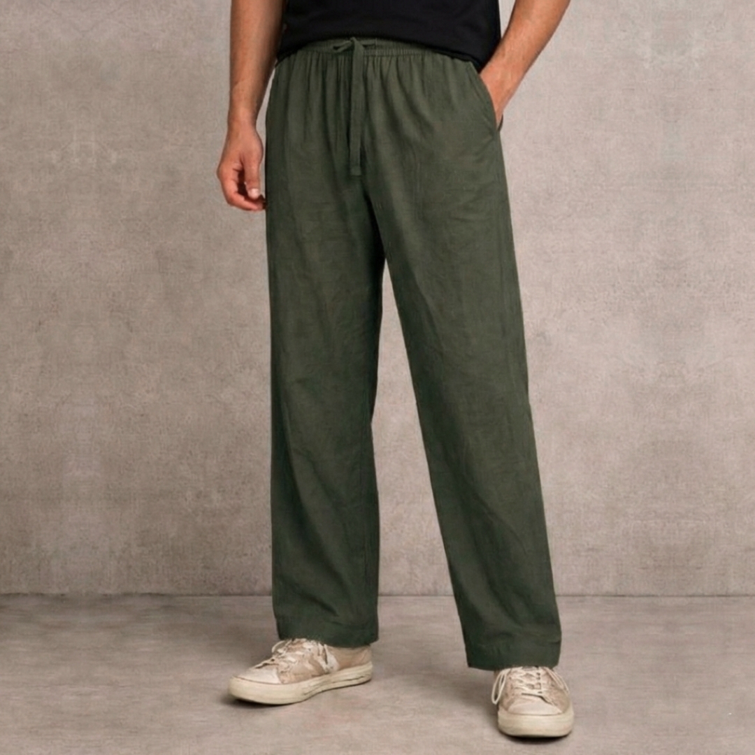Close up of precision tailoring on olive green oversized trousers Close up of precision tailoring on olive green oversized trousers