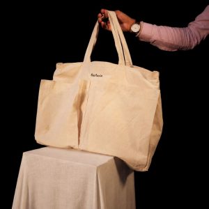 Lans Nomad Tote in natural cotton canvas with Eutopia embroidery and large front pockets