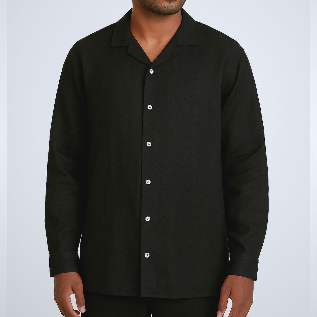 Relaxed Linen Shirt Collection – Black, Harvest Gold & Ivory | Lans Stack of three linen shirts in black, harvest gold, and ivory placed on a wooden stool — part of Lans’ Relaxed Cuban Collar Linen Collection