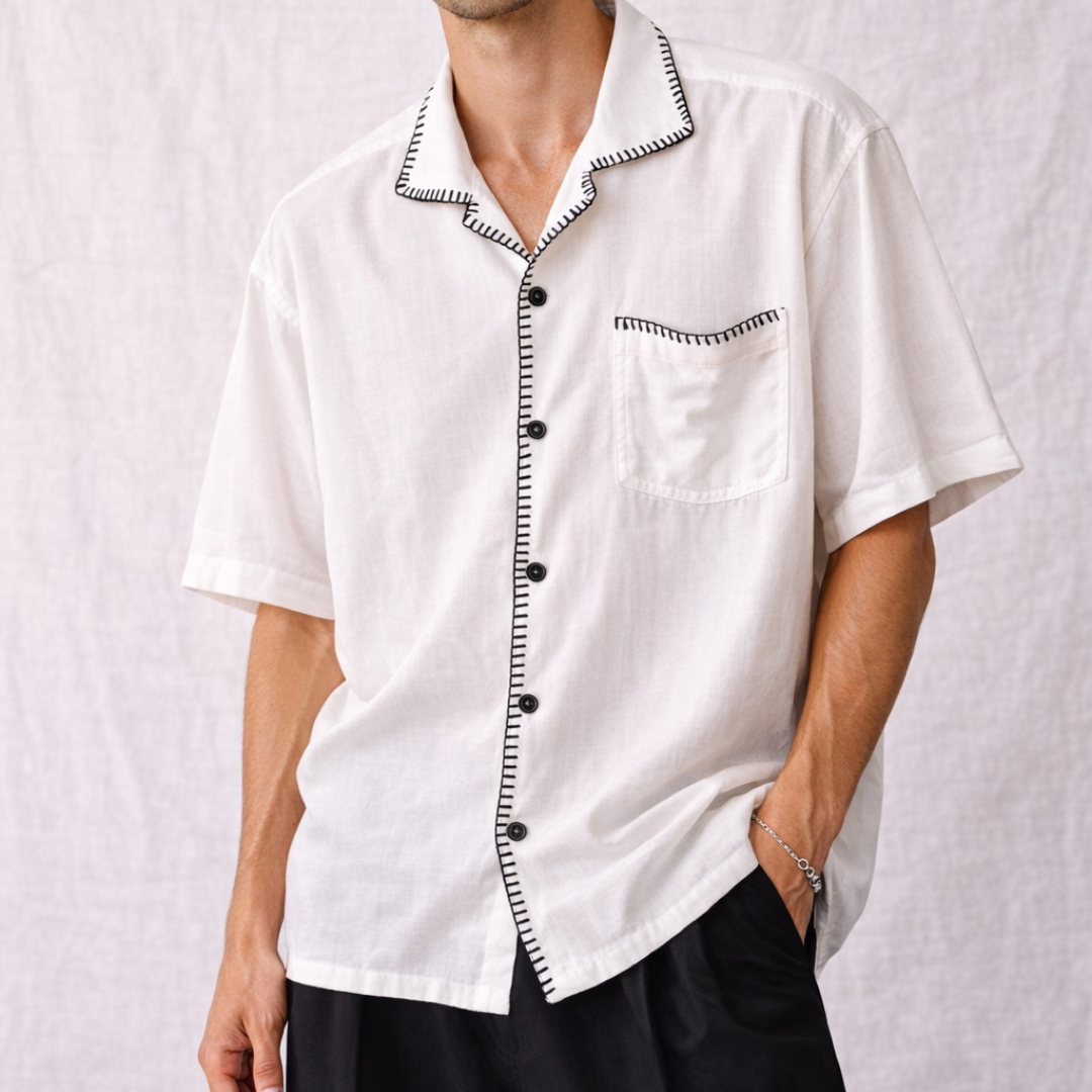 Man wearing oversized linen shirt art gallery style made in Sri Lanka (1) Crafted with soul in Sri Lanka. 🇱🇰 The Museo Heritage Shirt isn't just clothing; it's a feeling. Cut from pure linen in an oversized fit that lets the air—and the culture—flow freely. Available in sizes XS to 4XL.