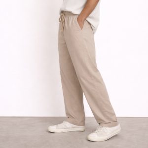 Close up of washed cotton fabric texture in greige grey beige tone