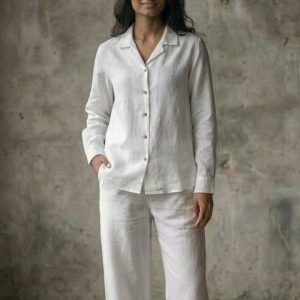 Woman wearing fluid oversized long sleeve shirt resort style made in Sri Lanka