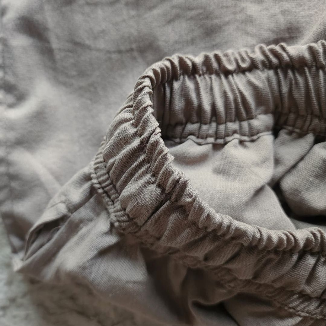 Close up of washed cotton fabric texture in greige grey beige tone Close up of washed cotton fabric texture in greige grey beige tone