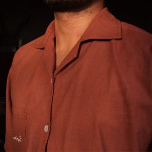 Close up of delicate Moroccan-inspired side embroidery on washed cotton shirt