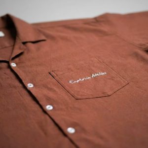 Close up of delicate Moroccan-inspired side embroidery on washed cotton shirt