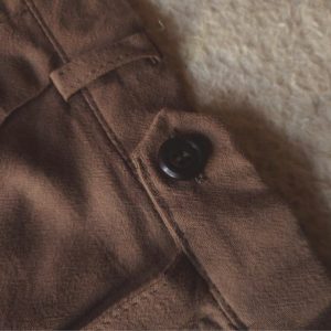 Close up of delicate Moroccan-inspired side embroidery on washed cotton shirt