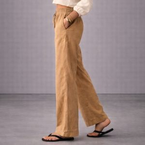 Close up of premium woven cotton fabric texture on women's trousers