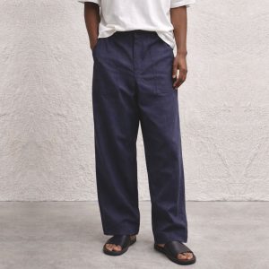 Oversized utility long pant with a relaxed fit, featuring a structured waistband, front utility pockets, and a straight wide-leg silhouette crafted for everyday comfort.