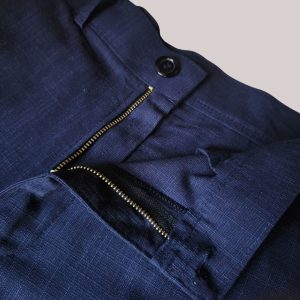 Metal zip fly detail on navy linen mariner short with tailored waistband