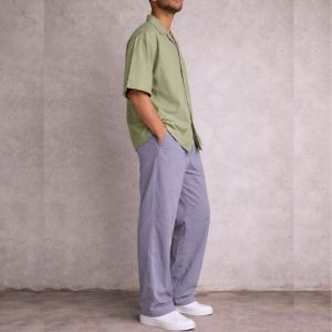 WOMEN WEARING OLIVE GREEN CUBAN SHORT SLEEVE SHIRT AND GREY LONG OVERSIZED PANT