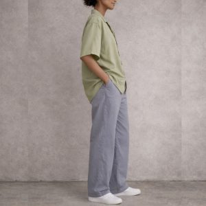 WOMEN WEARING OLIVE GREEN CUBAN SHORT SLEEVE SHIRT AND GREY LONG OVERSIZED PANT