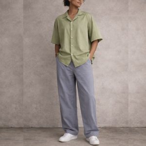 WOMEN WEARING OLIVE GREEN CUBAN SHORT SLEEVE SHIRT AND GREY LONG OVERSIZED PANT